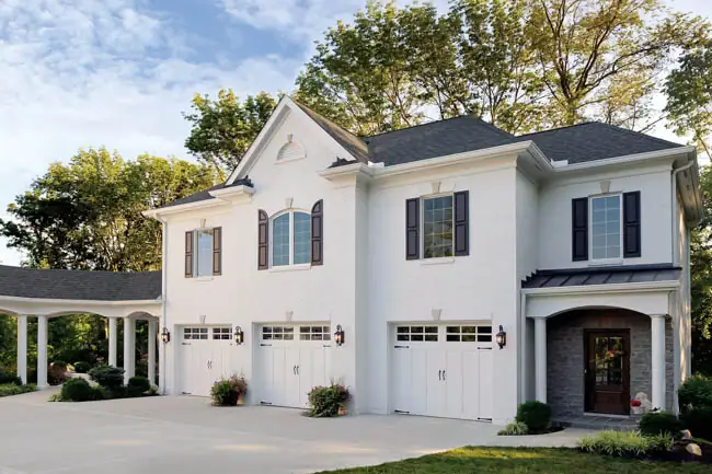 Coachman Collection — Steel Insulated with Composite Overlay garage door by Clopay