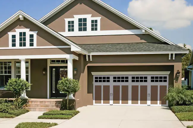 Coachman Collection — Steel Insulated with Composite Overlay garage door by Clopay