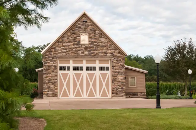 Coachman Collection — Steel Insulated with Composite Overlay garage door by Clopay