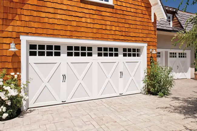 Coachman Collection — Steel Insulated with Composite Overlay garage door by Clopay