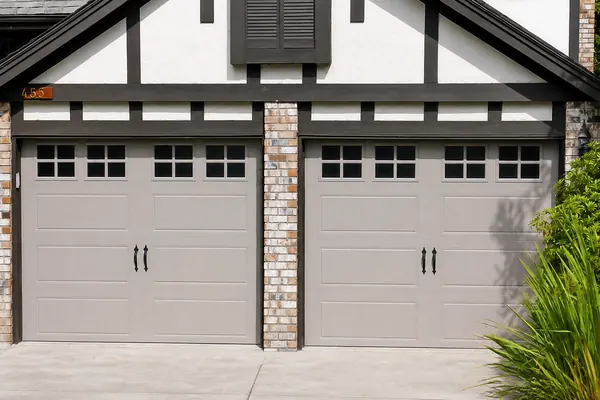 Clopay Gallery door in Sandtone, Long Panel insulated steel door. Long panel with short square grilles.