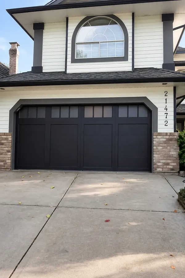 Home owner was looking for a modern garage door. After a consultation this Coachman carriage style door by Clopay was selected and then cust