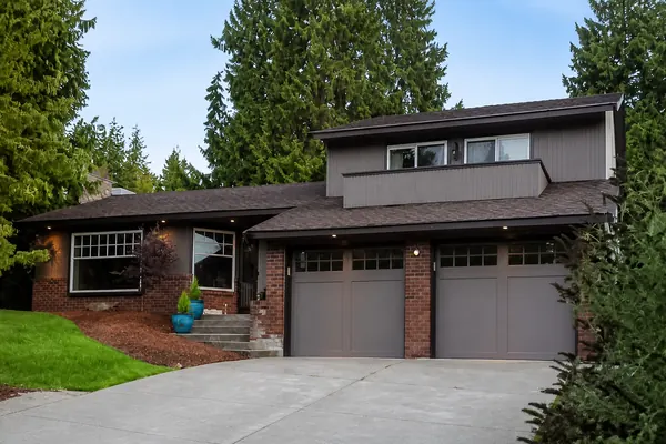 Home owners complemented the renovation by having us install four layer steel insulated, with overlay, Coachman garage doors by Clopay and p
