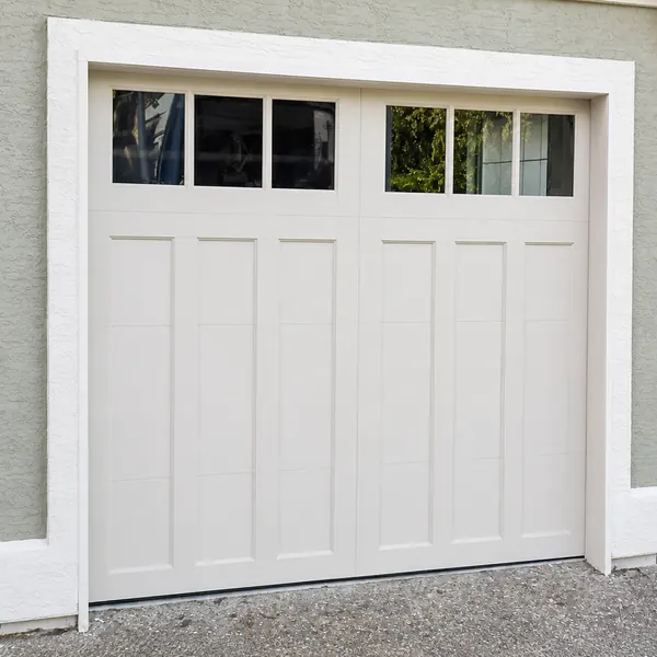 Beautiful Clopay Coachman garage doors, in model CD13 REC13 windows, Sandtone base and overlay.