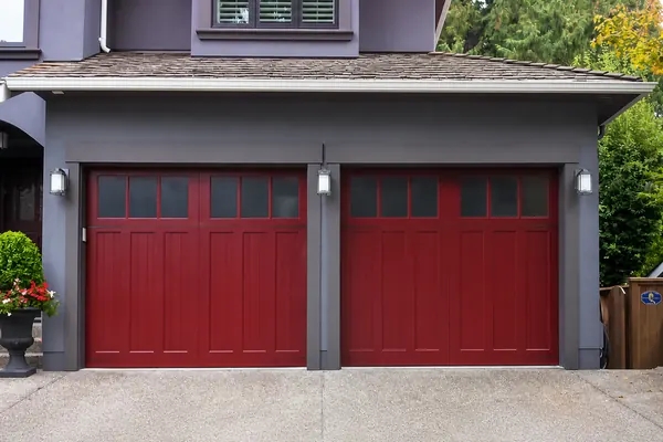 Beautifully crafted, custom wood garage doors in Mahogany by Clopay.