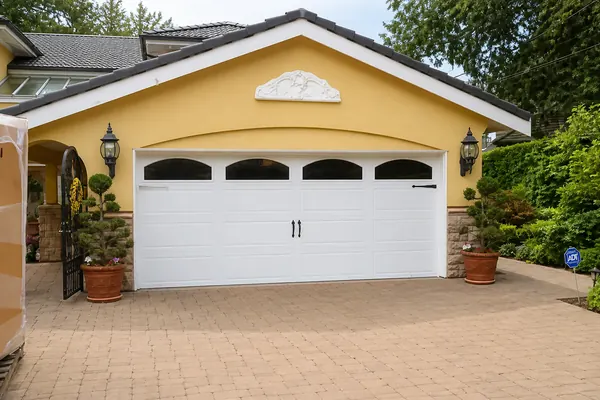 This Clopay Gallery Door with Wrought Iron windows is a great example of how a new garage door can transform the curb appeal of your home. T