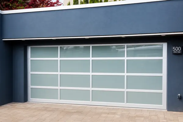This modern garage door by Clopay is the Avante Garage Door with White Laminate glass. The advantage of this glass is the smooth surface on 